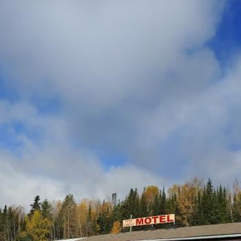 View of sky and sign at motel