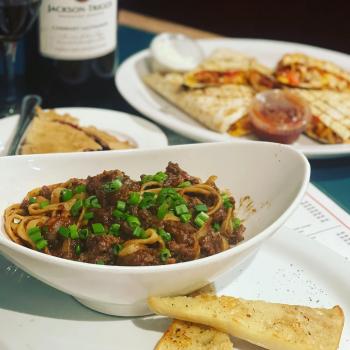 a bowl of meat and noodles