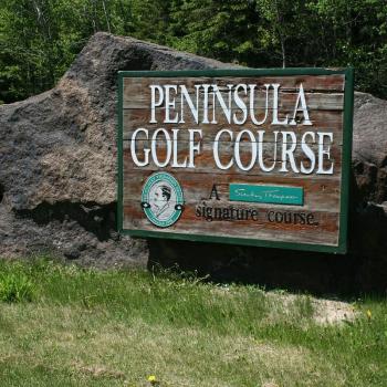 Signage by golf course