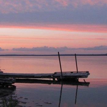 Dock on lake during dusk