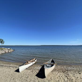 Beachfront with two canoes on shore