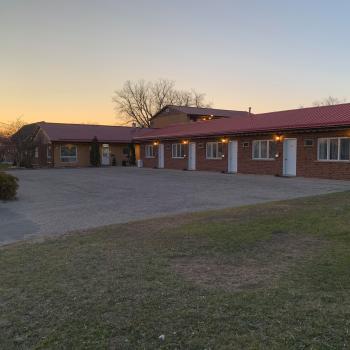 Exterior of motel at dusk