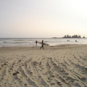 surfers on beach