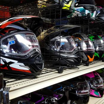 snowmobile helmets for sale on shelf