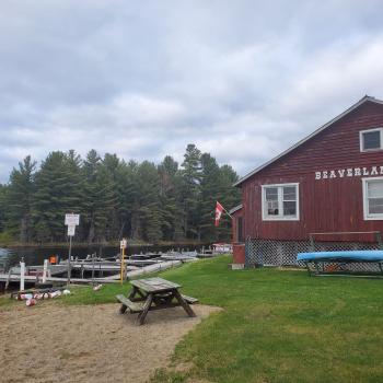 Lodge at the side of water with boats