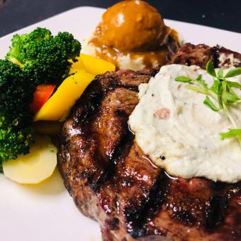 Steak, potatoes and vegetables