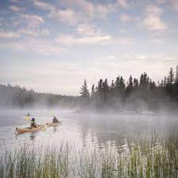 Kayaks on the lake with fog