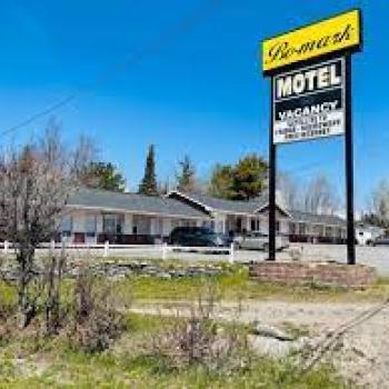 Exterior of motel with sign