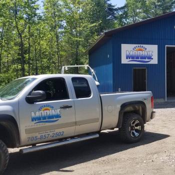 Truck and garage with logo