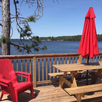 Patio with chairs looking over lake