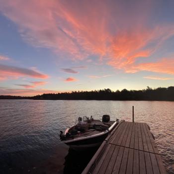 Boat and dock at sunset