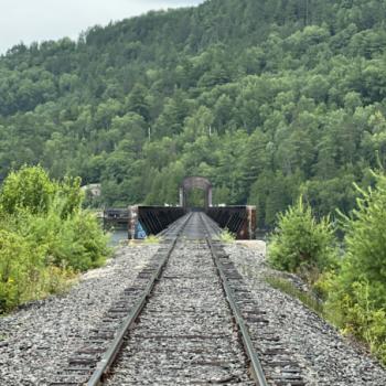 looking down railway line to bridge