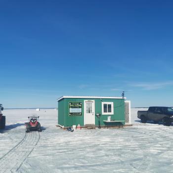 Ice hut on lake