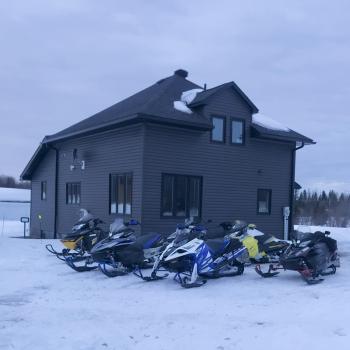 House with snowmobiles