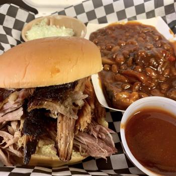 Pulled pork on bun with baked beans