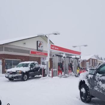 Gas station with snowmobile