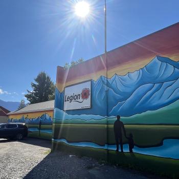 a colourful mural of mountains on the side of a building