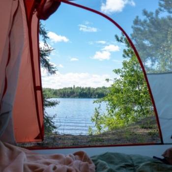 Inside of tent looking out at lake