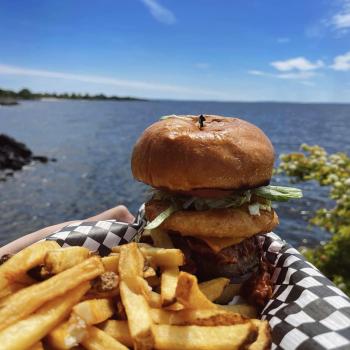 burger and fries by the lake