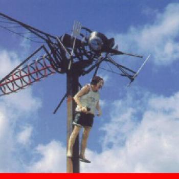 Giant Mosquito statue carrying a man 