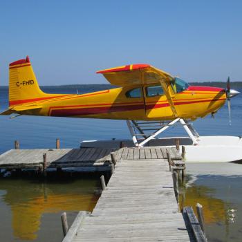 float plane at dock on lake