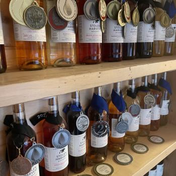 a wall with bottle of distilled alcohol